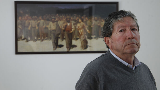 José Antonio Nieto, en su despacho de abogados de Las Golondrinas, junto al cuadro 'El Cuarto Estado' de Pellizza da Volpedo.