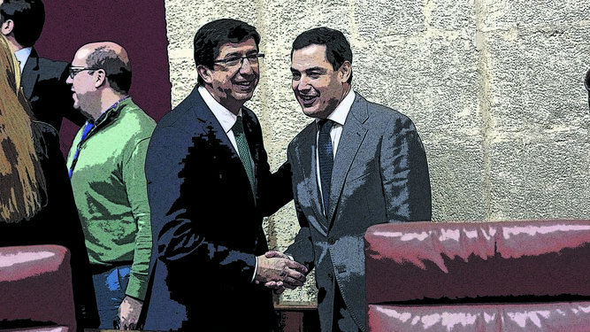Marín da la mano a Moreno en el Parlamento andaluz.