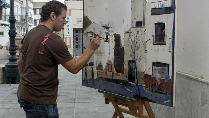 Artista pinta su obra en un Concurso de Pintura Rápida en la calle, en una imagen de archivo.